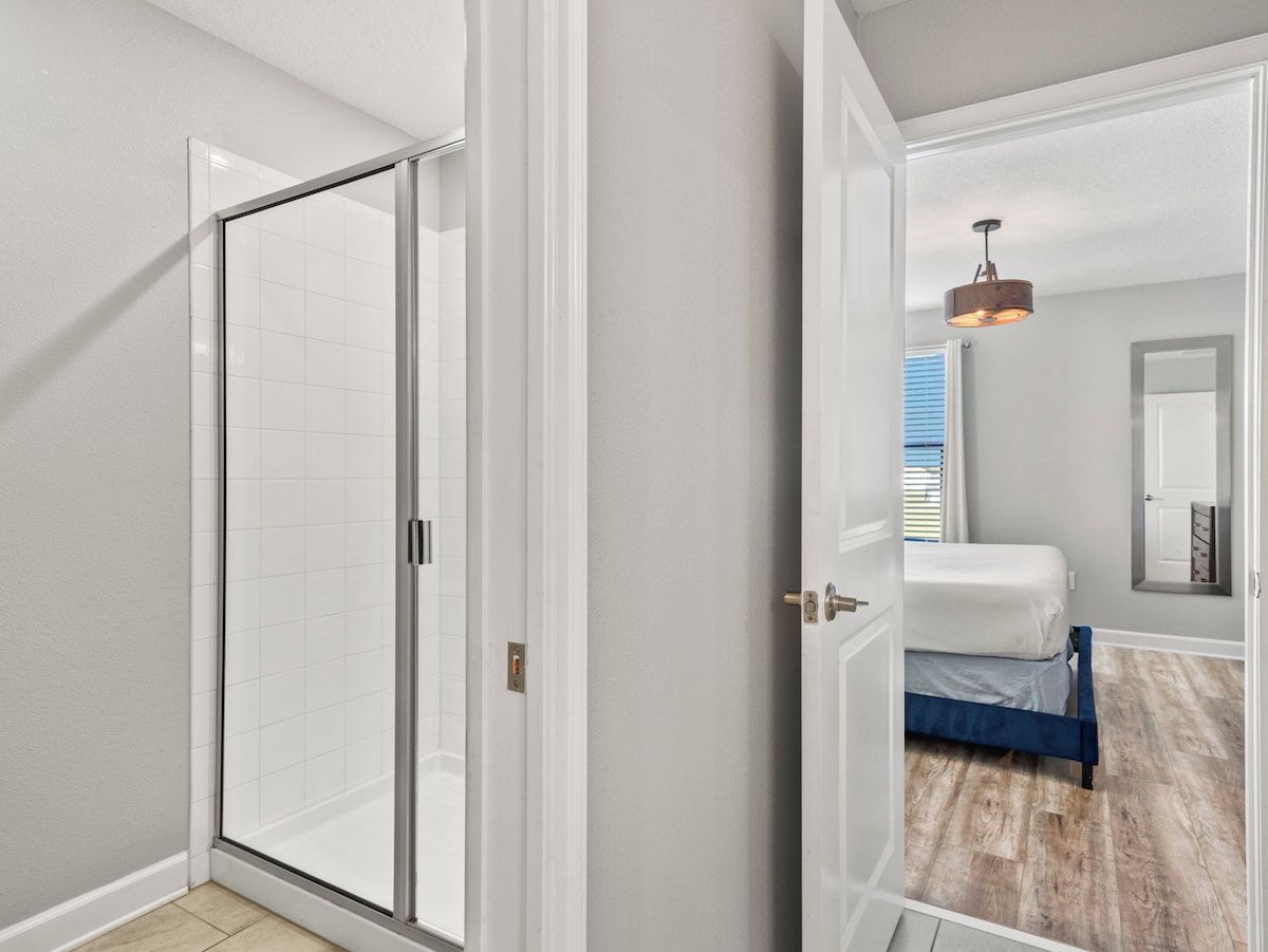 Bathroom 3 with a walk-in shower and double sink