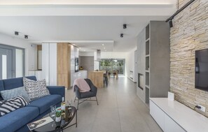 Smart TV, fireplace, video game console, table football