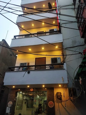 Front of property - evening/night - ADB Rooms Toto International (New Delhi)