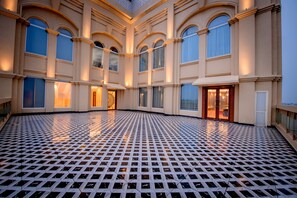A spacious atrium with a patterned floor, large windows, and a grand entrance. - Best Western Kapurthala (Kapurthala)