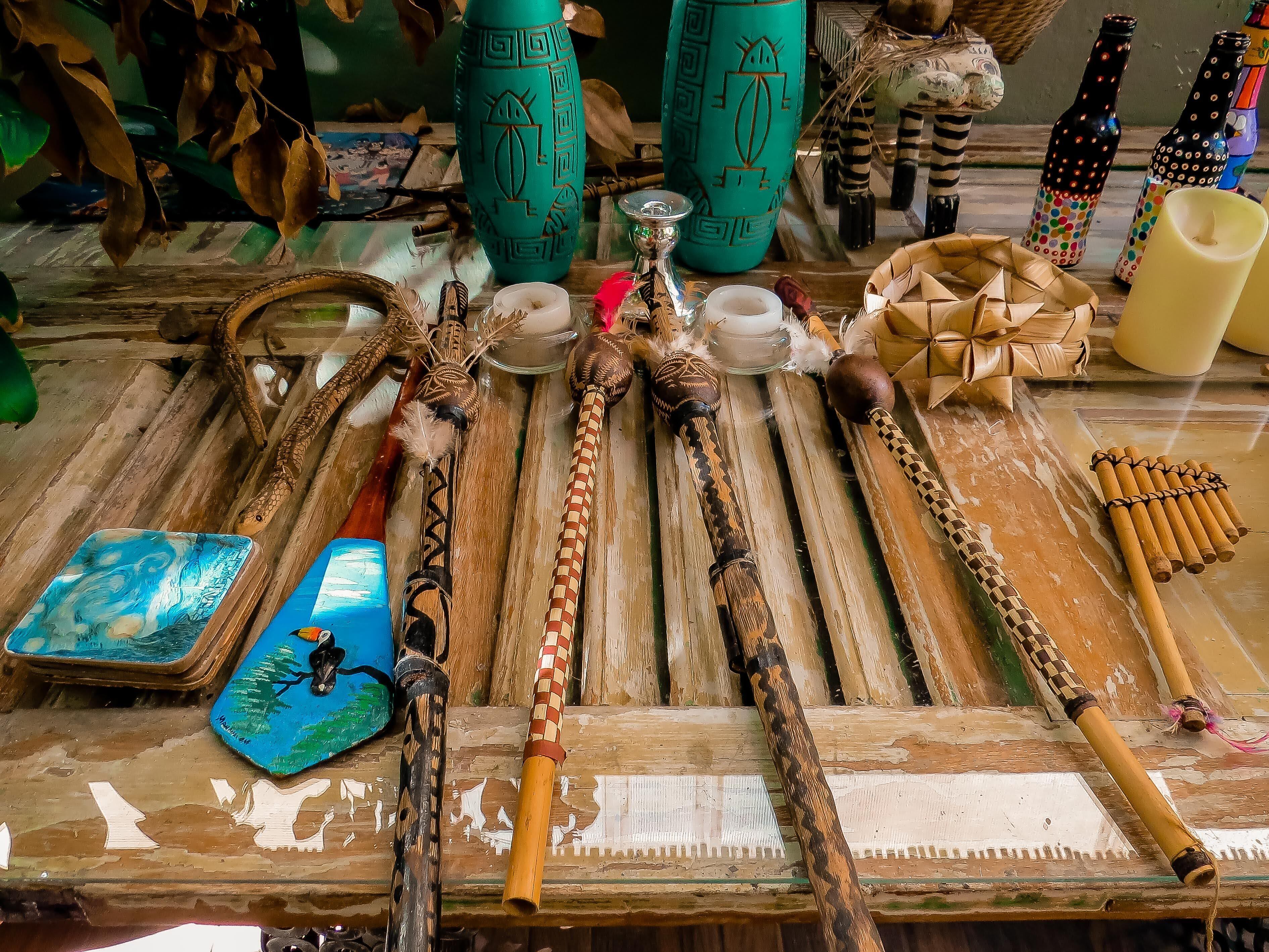 A variety of traditional artifacts and decorative items displayed on a wooden surface.