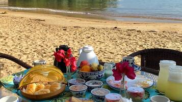 On the beach, white sand, sun loungers, beach umbrellas