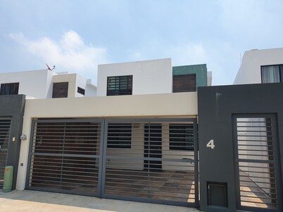 Entire house furnished 3 bedrooms 3 bathrooms security heated parking.