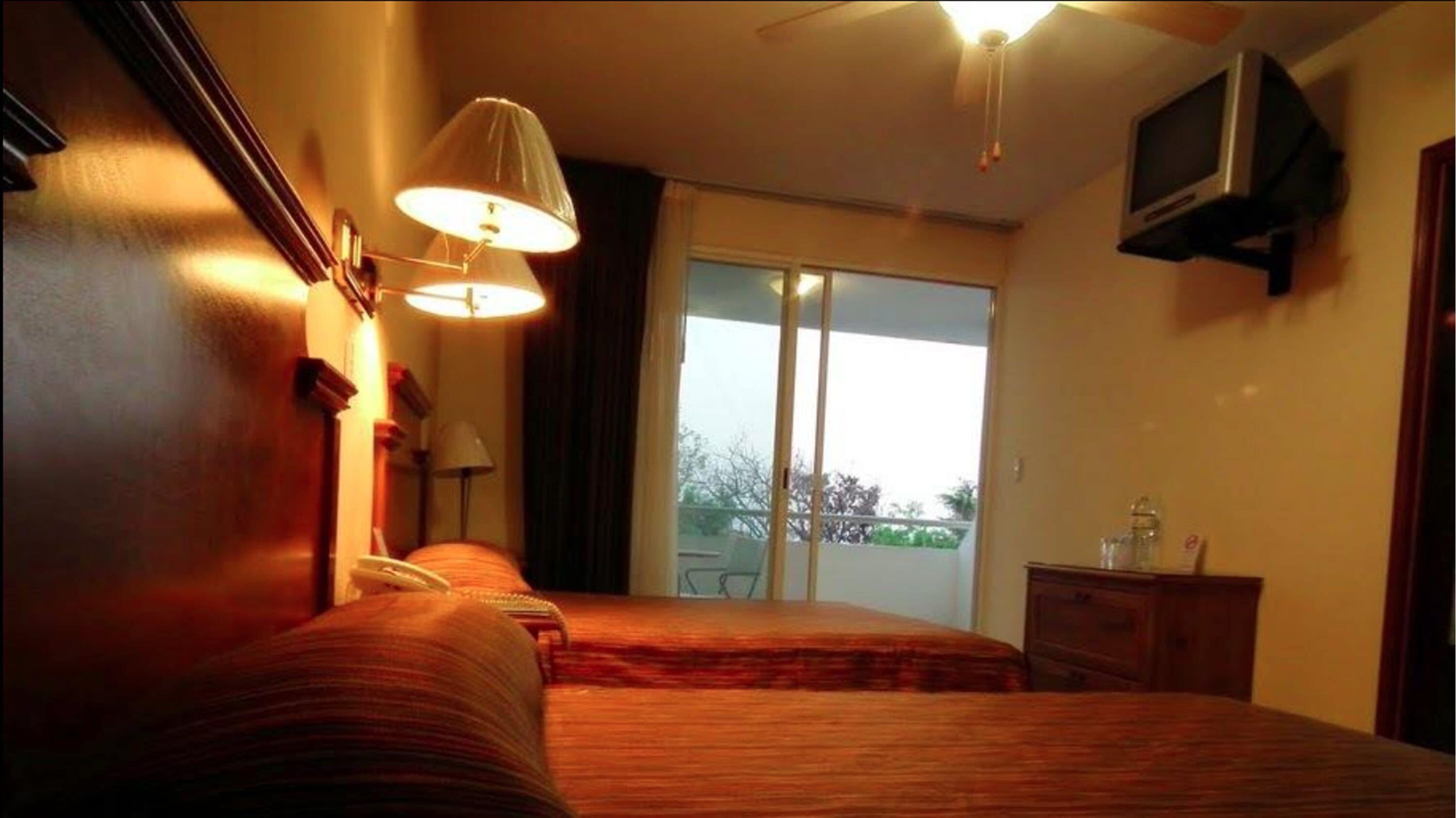 family room | 1 bedroom, in-room safe, individually decorated, individually furnished