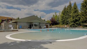 A swimming pool area with a building, trees, and a clear sky. - Ranch Condo 3580 -  Elkhorn Resort Amenities (Elkhorn)