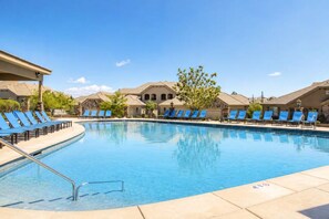 A swimming pool with blue lounge chairs and a clear sky. - Spacious backyard & 2 pools/spas, fishing pond (Washington)
