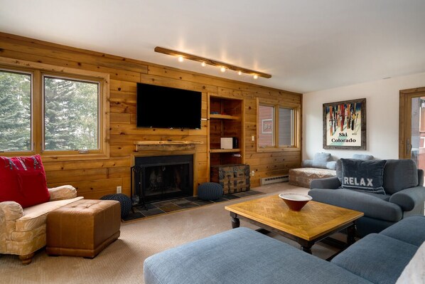 Flat-screen TV, fireplace, computer monitors