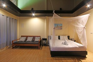 Ocean View Villa | Living room | 32-inch LED TV with satellite channels, TV - Jonas & Twins Resort (General Luna)