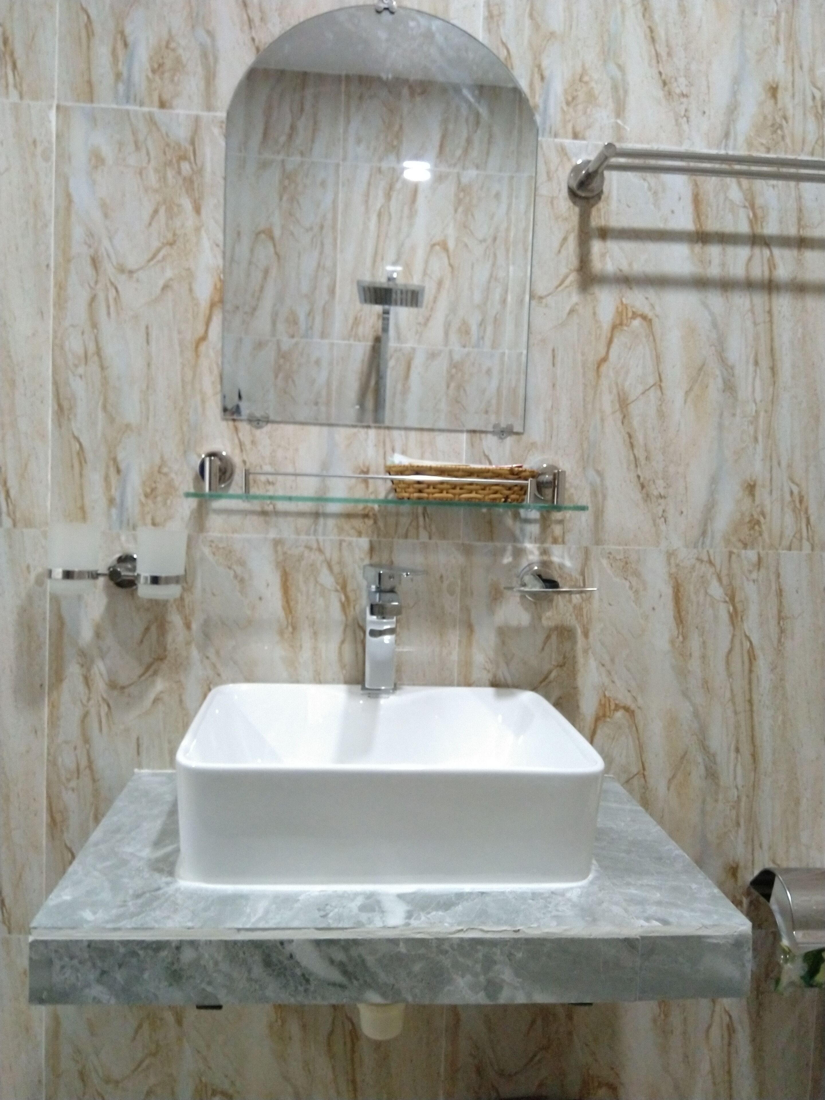 designer toiletries, hair dryer, slippers, bidet