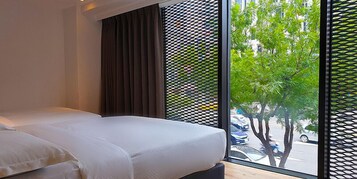 Elite Quadruple Room | Down comforters, blackout drapes, free WiFi, bed sheets