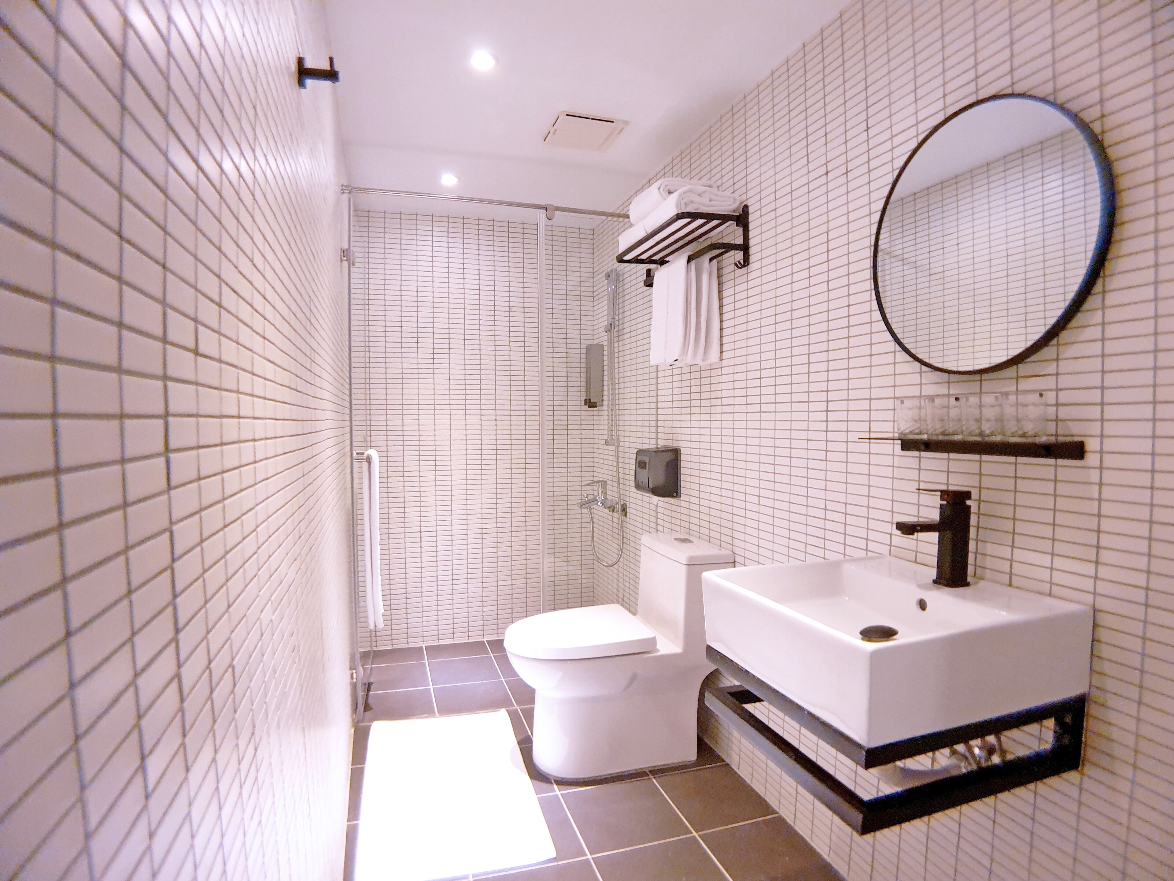 shower, rainfall showerhead, hair dryer, towels