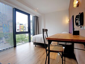 Deluxe Double Room | Down comforters, blackout drapes, free WiFi, bed sheets - River inn Station (Kaohsiung)