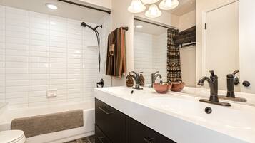 Combined shower/tub, hair dryer, towels, soap