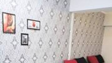 Standard Double Room | Living room | Flat-screen TV