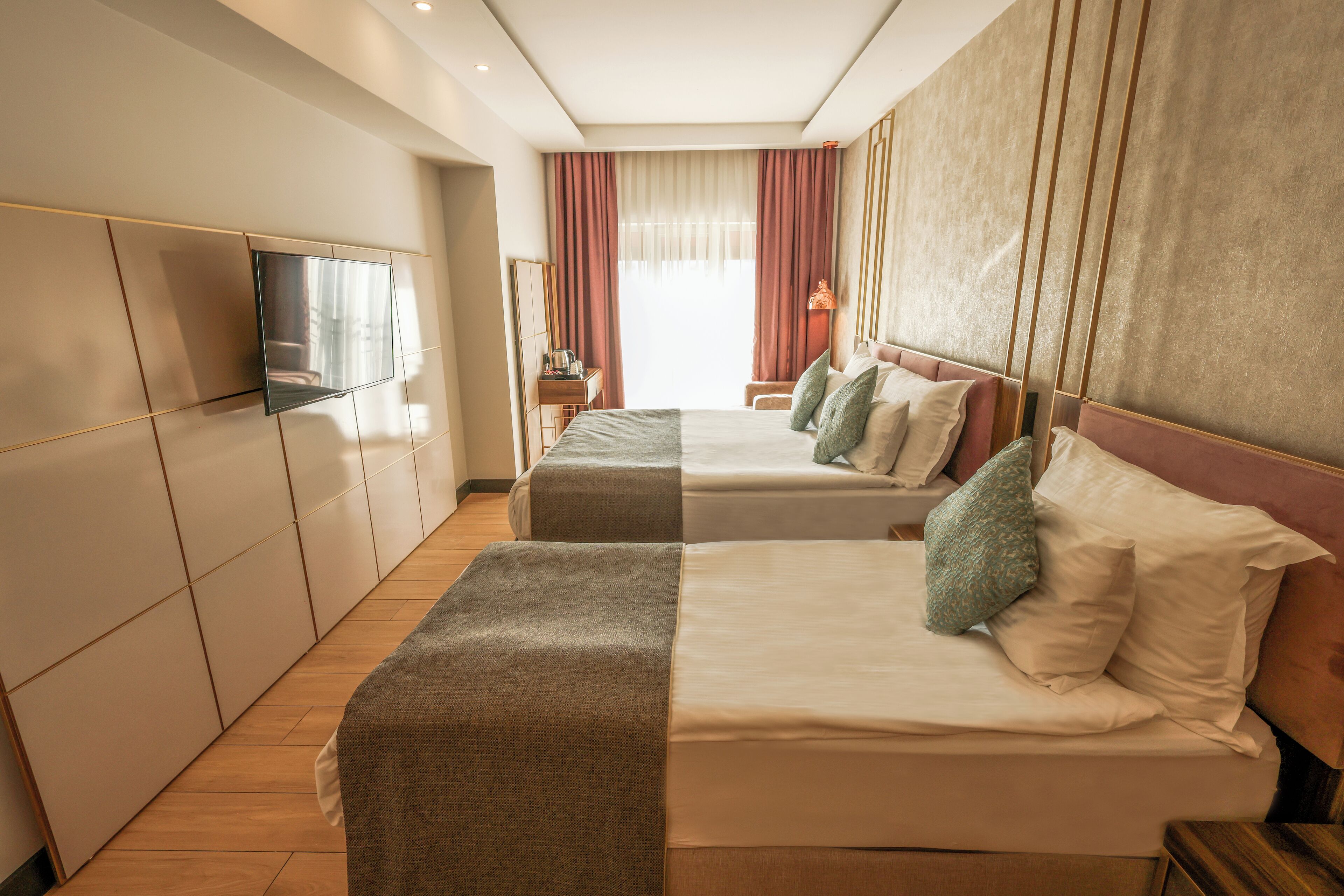 standard triple room, city view | minibar, in-room safe, blackout curtains, soundproofing
