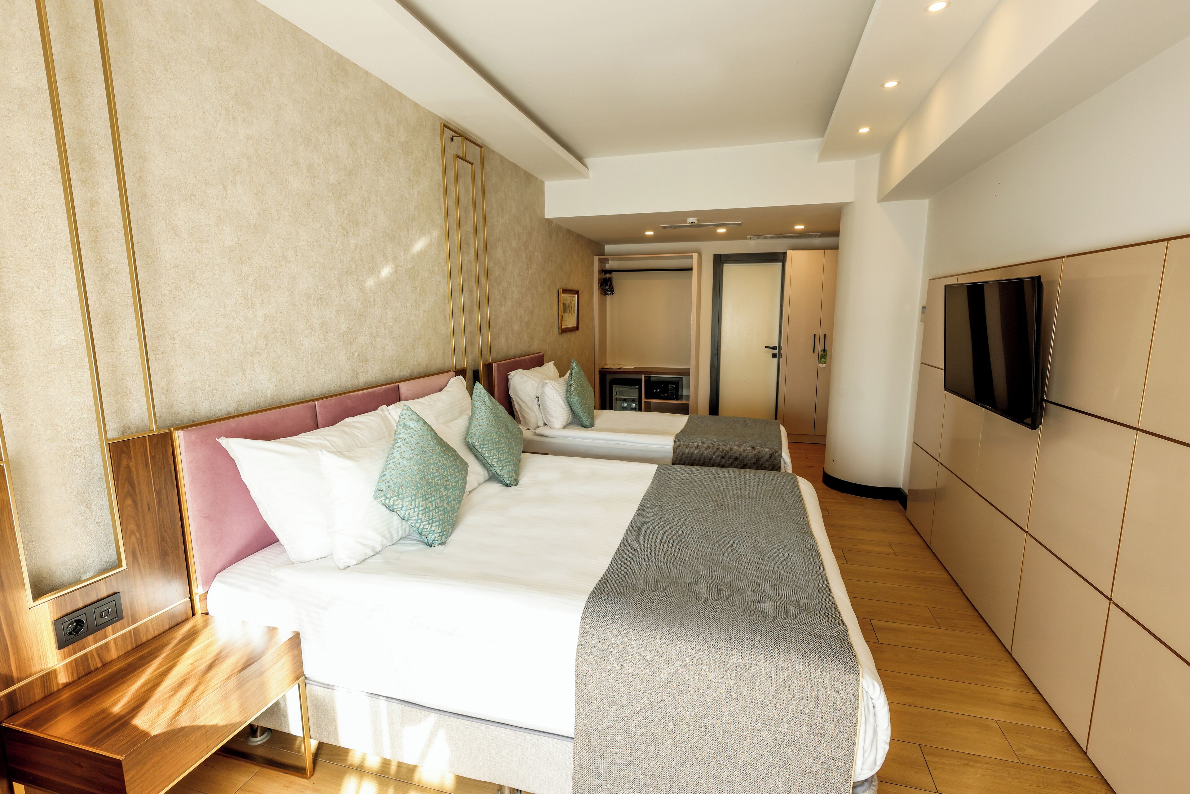 standard triple room, city view | minibar, in-room safe, blackout curtains, soundproofing