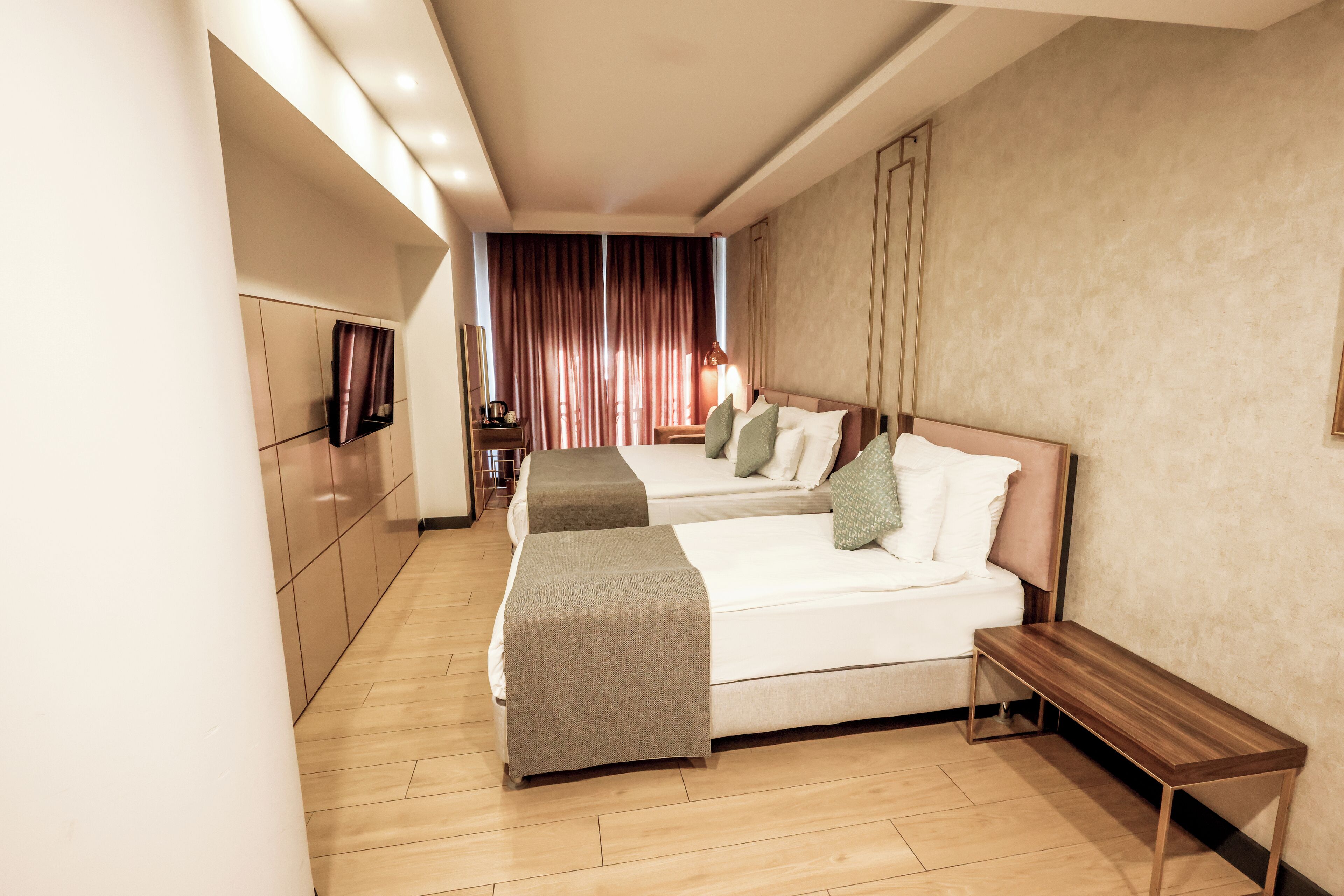 standard triple room, city view | minibar, in-room safe, blackout curtains, soundproofing