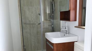 Designer toiletries, hair dryer, slippers, bidet