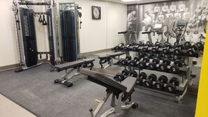 A gym with weightlifting equipment, treadmills, and a wall with a motivational poster. - Hotel Indigo Spokane Downtown by IHG (Spokane)