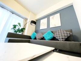 3 Bedroom Apartment with Balcony 504 | Living area | Flat-screen TV