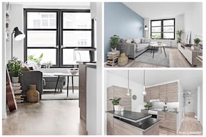 A modern apartment with a living room, dining area, and kitchen.