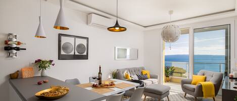 Apartment, Sea View | Living area | Flat-screen TV