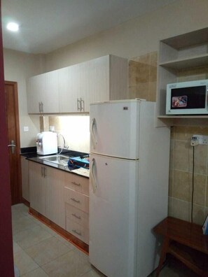 Double Room | Private kitchenette | Fridge, stovetop, cookware/dishes/utensils - West View Suits (Nairobi)