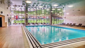 Indoor pool, open 10:00 AM to 10:00 PM, pool loungers