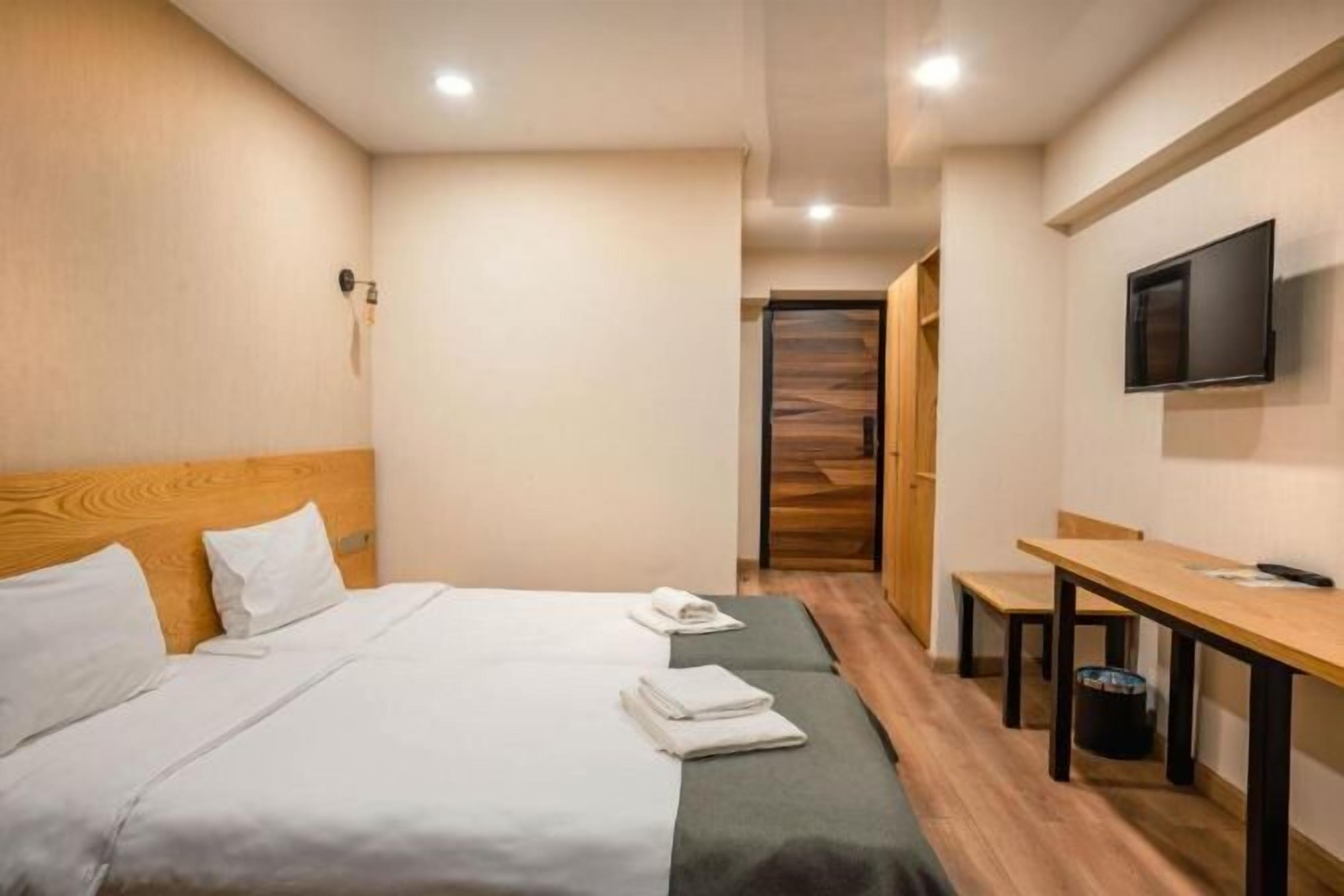 Luxe beddengoed, bedden met traagschuimmatrassen, een kluis op de kamer