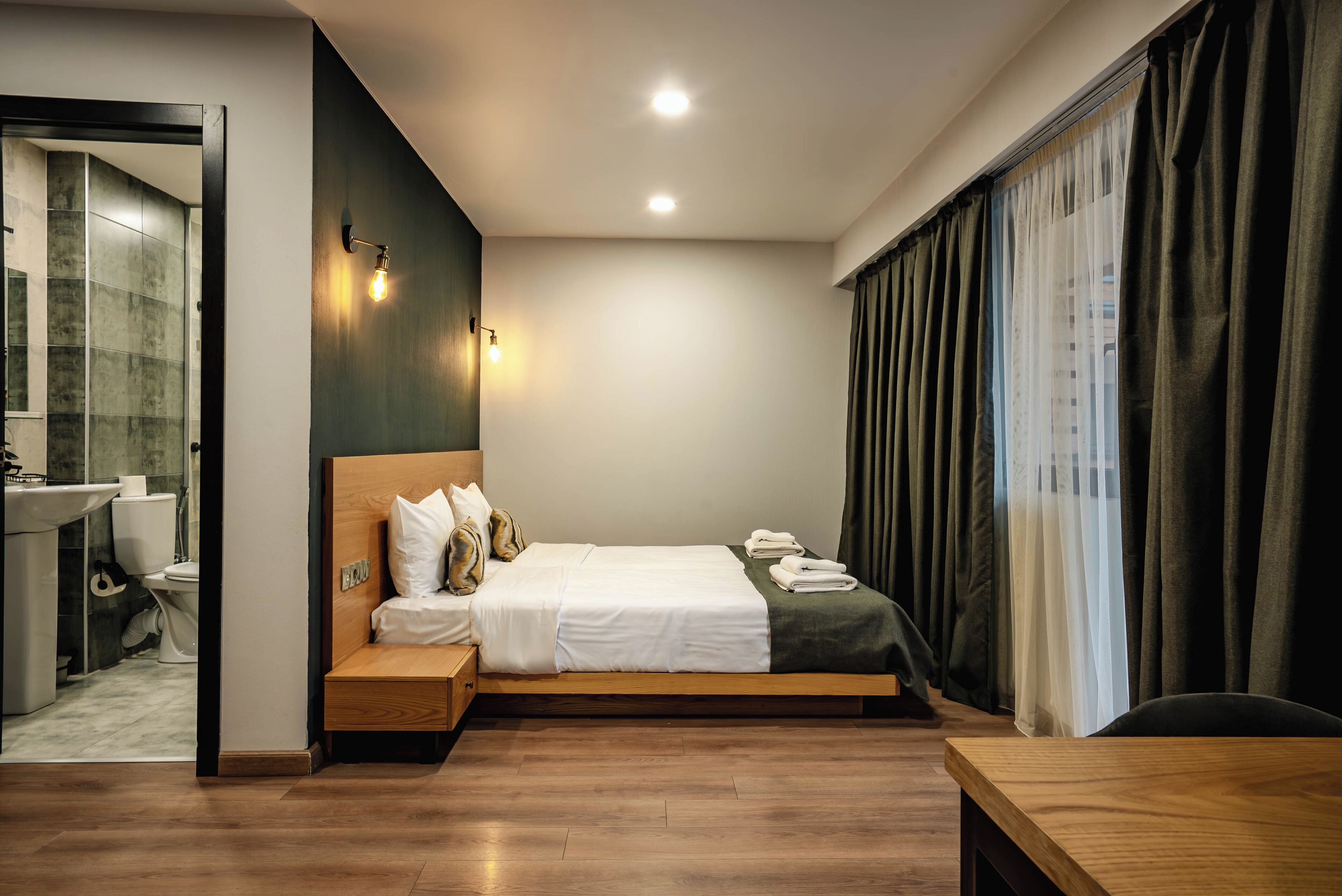 Family Back View With Balcony | Premium bedding, memory foam beds, in-room safe, individually decorated