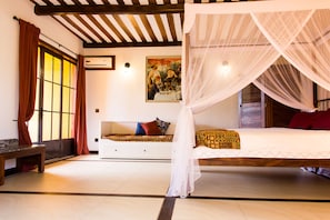 Studio Suite, 1 Queen Bed | Minibar, in-room safe, individually decorated, individually furnished - Hotel Le Bougainviller (Kampala)