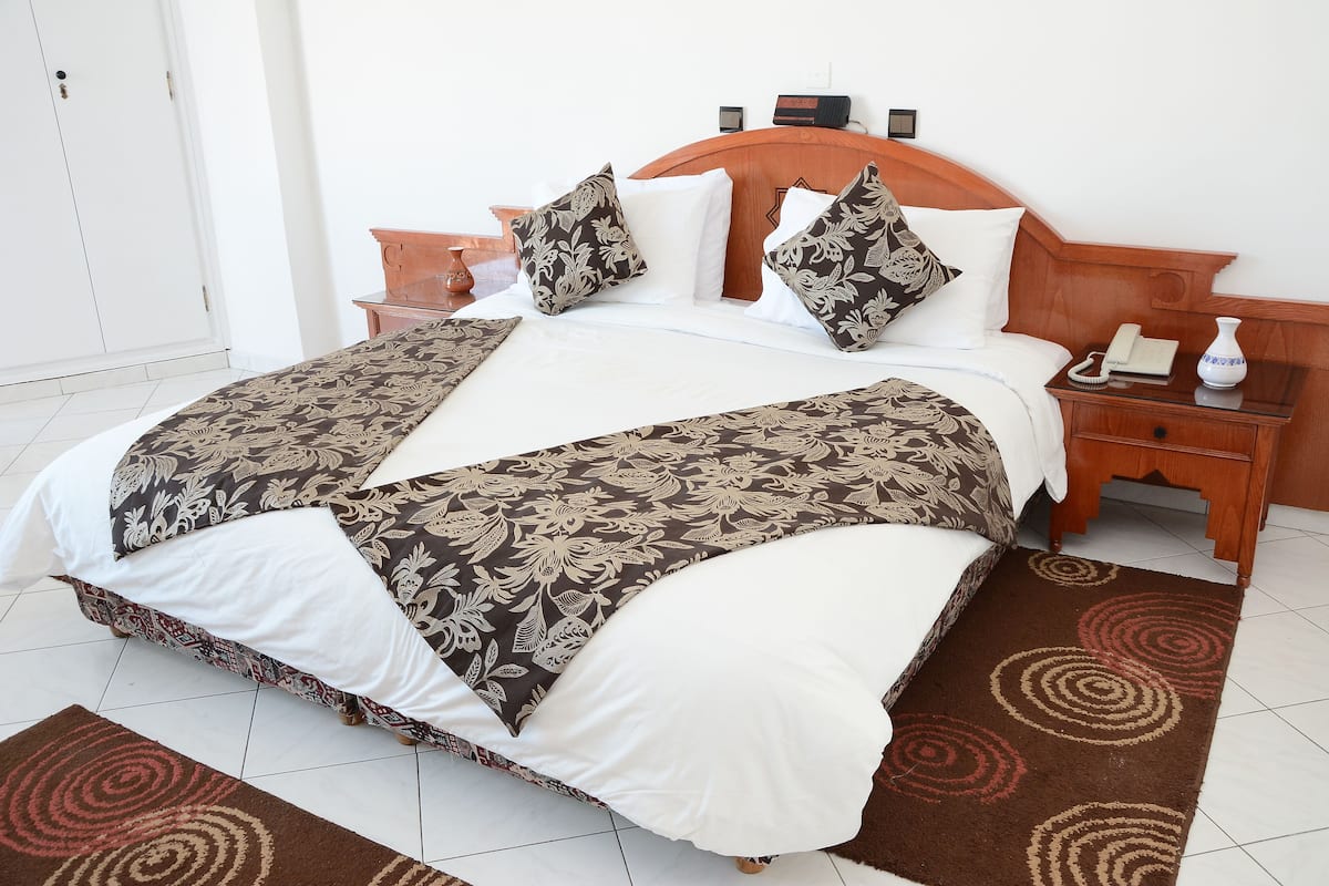 classic single room | living area | 42-inch flat-screen tv with cable channels, tv, heated floors