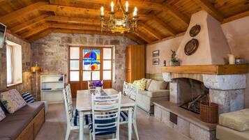 Studio, Sea View | Living area | Flat-screen TV