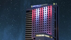 A hotel with a modern design, featuring a prominent sign at the top and a clear view of the building's facade. - Nevali Hotel (Sanliurfa)