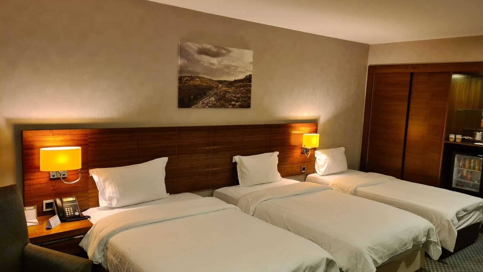 Triple Room, City View | Premium bedding, down comforters, memory foam beds, in-room safe