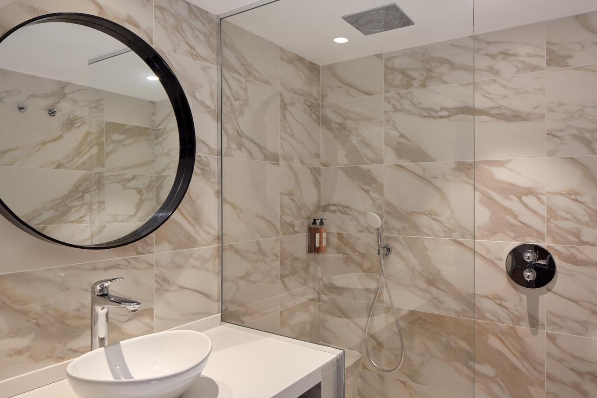 shower, hair dryer, slippers, towels