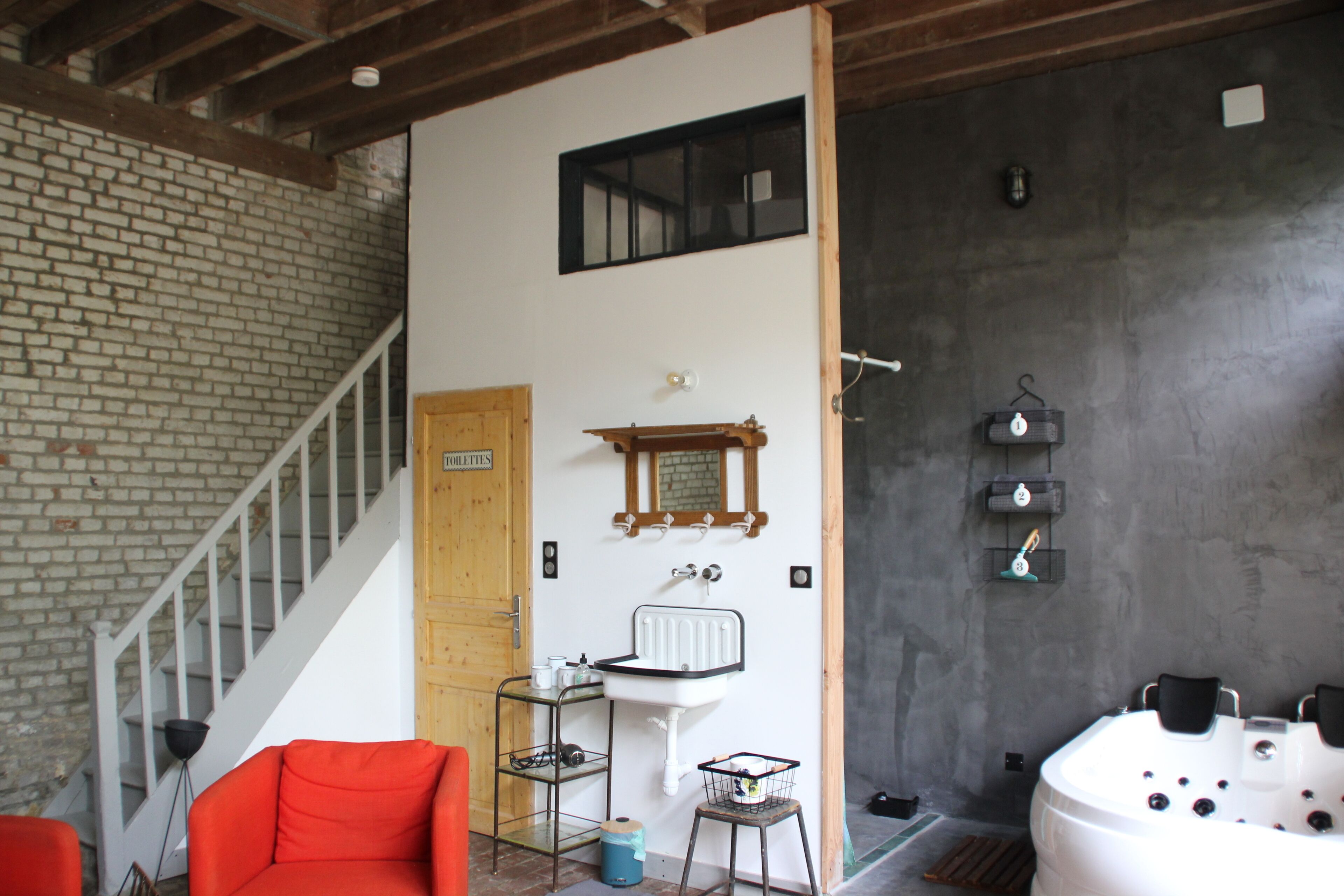 A bathroom with a white sink, a mirror, a shower, and a bathtub.