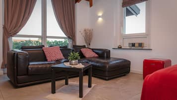 Chambre Quadruple Luxe | Coin séjour