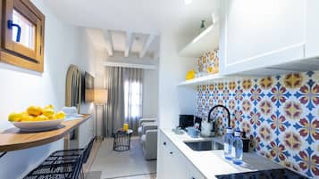 Luxury Studio Suite | Private kitchen | Full-sized fridge, microwave, stovetop, coffee/tea maker