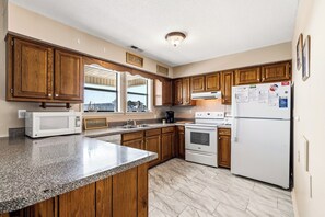 Fridge, microwave, oven, stovetop - High Tide - A Fisherman's Delight:  4 BR Channel Home w/ Boat Ramp in Cherry Grove (North Myrtle Beach)