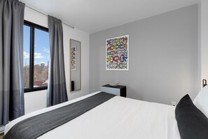 1 bedroom, desk, iron/ironing board, travel crib