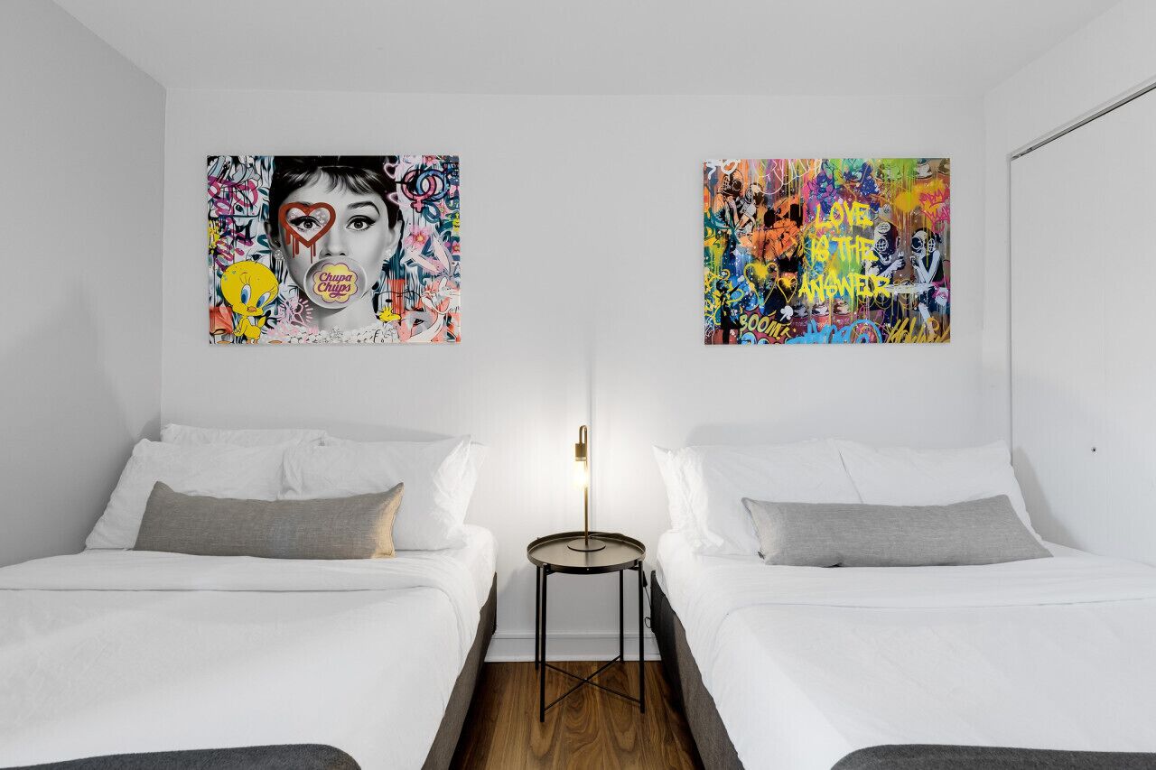 Bedroom #2: Features 2 queen beds and 1 futon bed, all with luxurious memory foam mattresses.