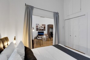 1 bedroom, desk, iron/ironing board, travel crib