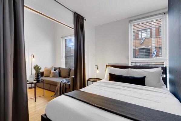 1 bedroom, desk, iron/ironing board, travel crib