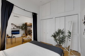 1 bedroom, desk, iron/ironing board, travel crib