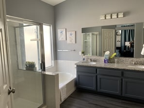 Bathtub, hair dryer, towels, soap