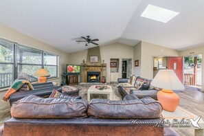 Flat-screen TV, fireplace, DVD player, books