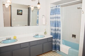 Combined shower/tub, hair dryer, towels, soap
