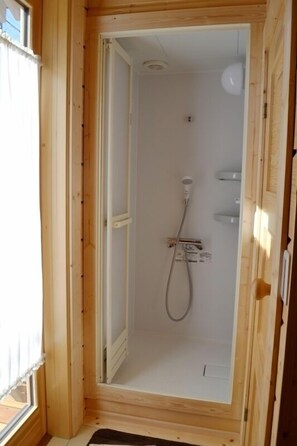 A wooden-framed shower room with a glass door, a showerhead, and a control panel. - Polar House Karuizawa 1 (Karuizawa)