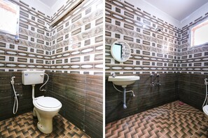 Habitación Deluxe | Baño | Regadera, amenidades de baño gratuitas, toallas